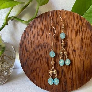 Light blue and gold tone earrings
